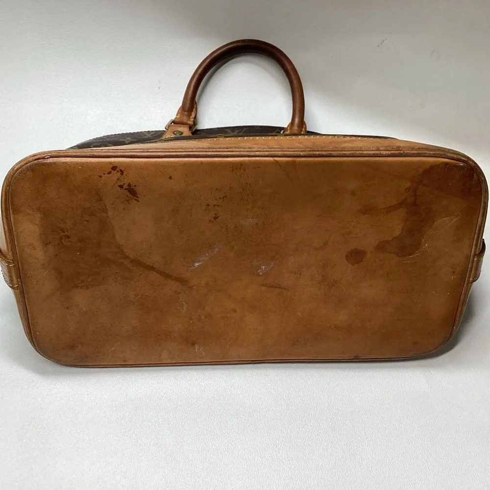 Louis Vuitton Monogram Alma Handbag Brown Coated Canvas Leather